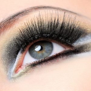 Creativity golden-brown modern make-up with long eyelashes